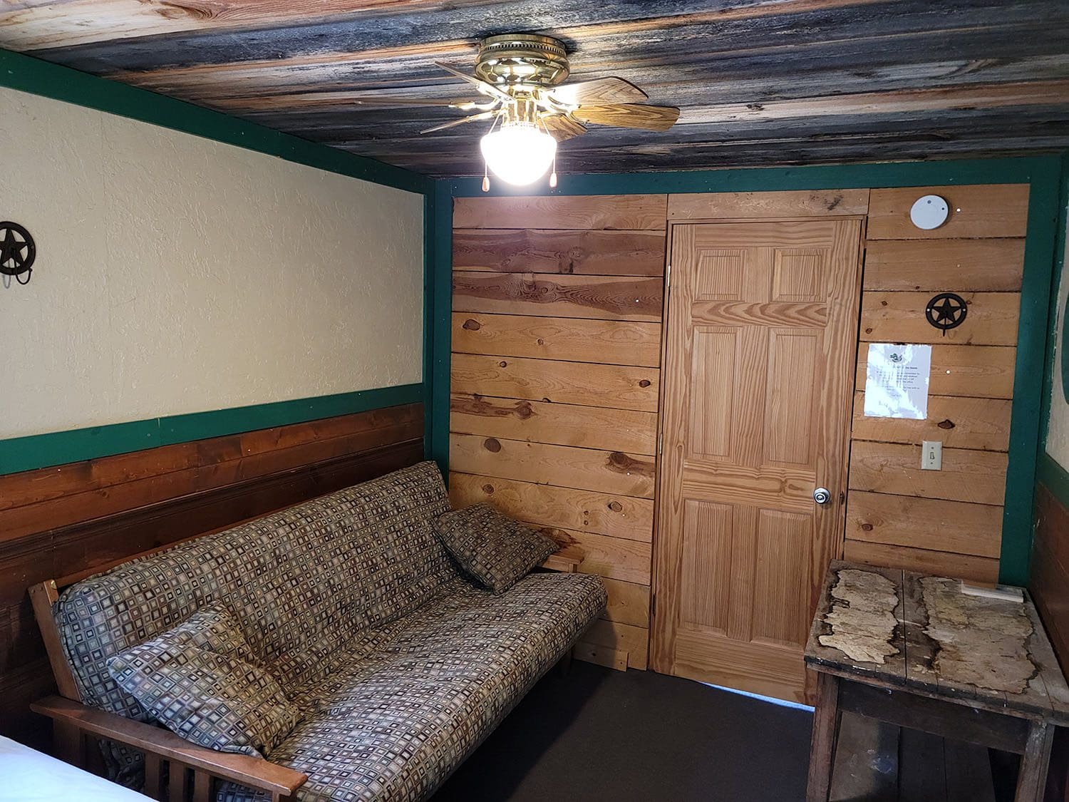 Sitting Bull bedroom with futon and table